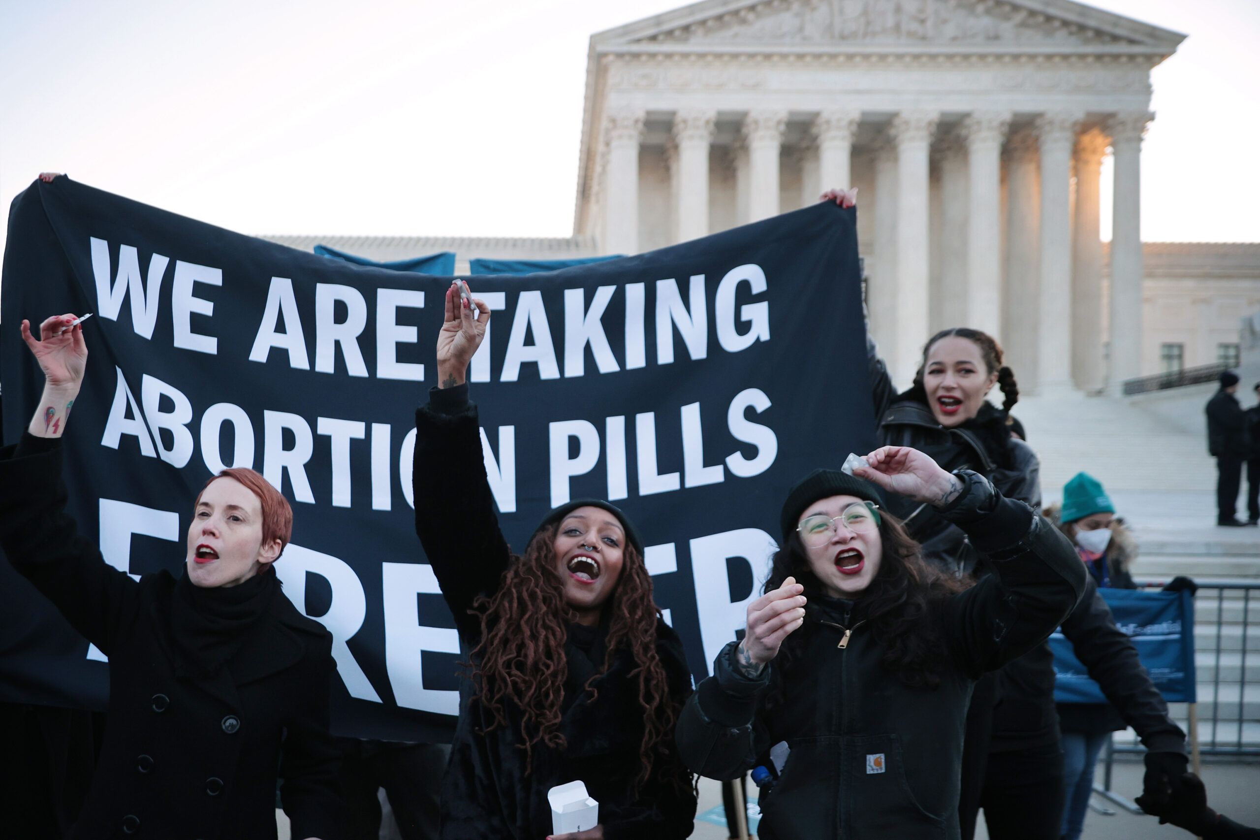 Reproductive rights protesters amid Mississippi abortion case