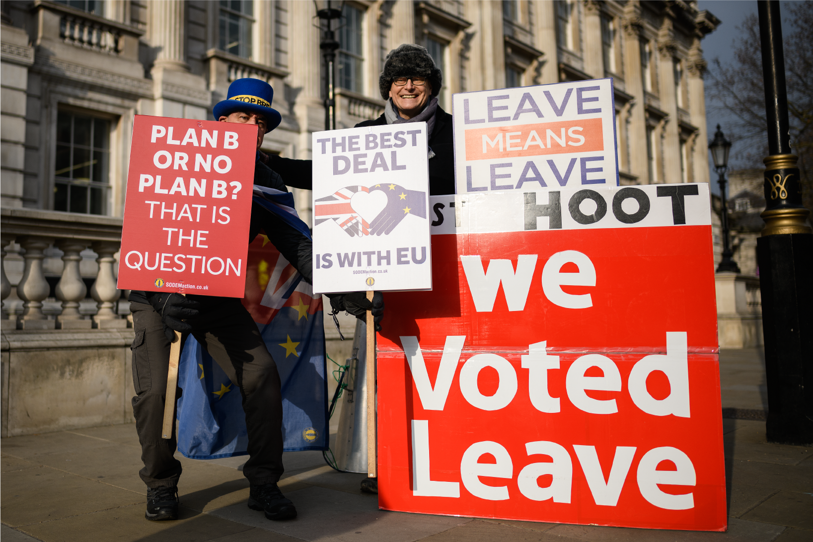 Photograph of Brexit supporters and protesters holding signs