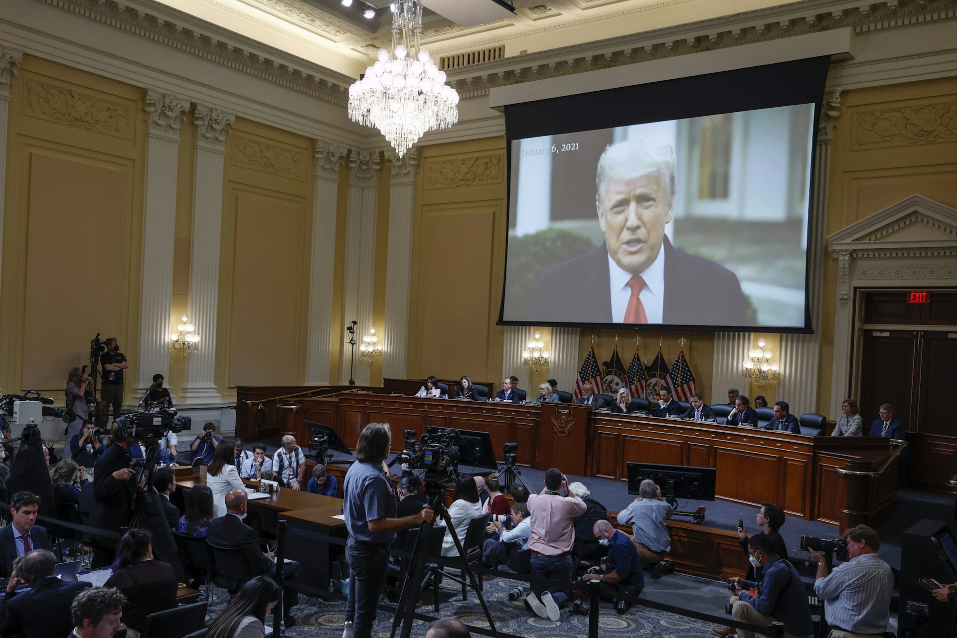 Photograph of video of former president Trump being projected during hearing by House Select Committee