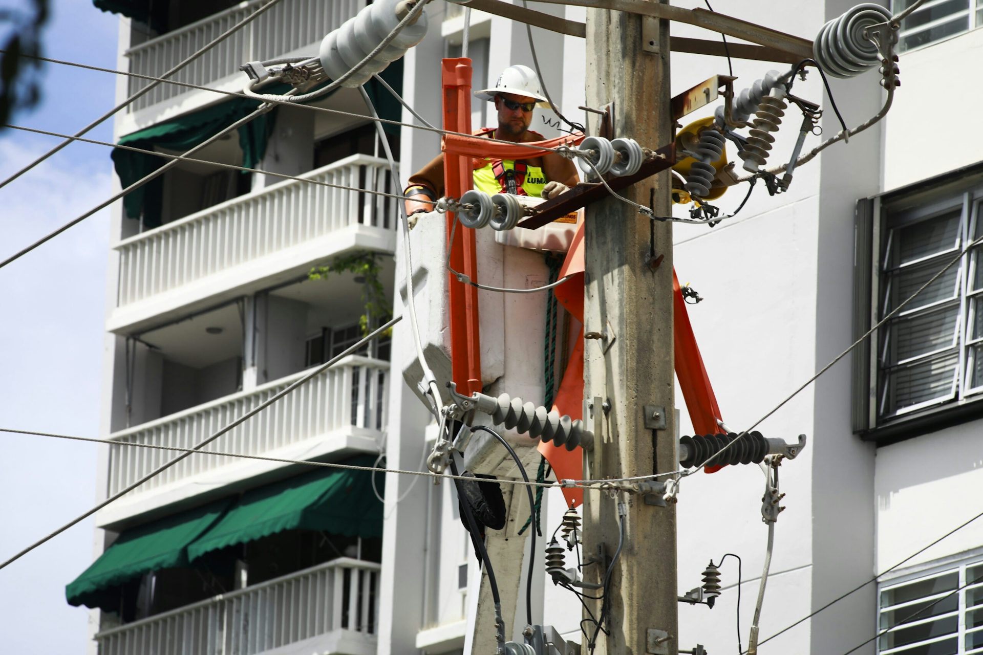 Photograph of utility crews completing repairs in Puerto Rico in the aftermath of Hurricane Fiona