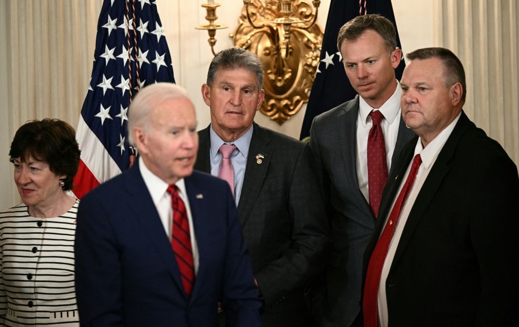 Image of Sens. Joe Manchin (D-W.Va.) and Jon Tester (D-Mont.) at the White House with President Joe Biden.