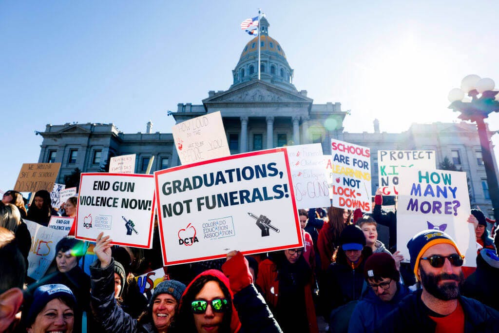Photograph of people gathered at the Colorado State Capitol to protest gun violence